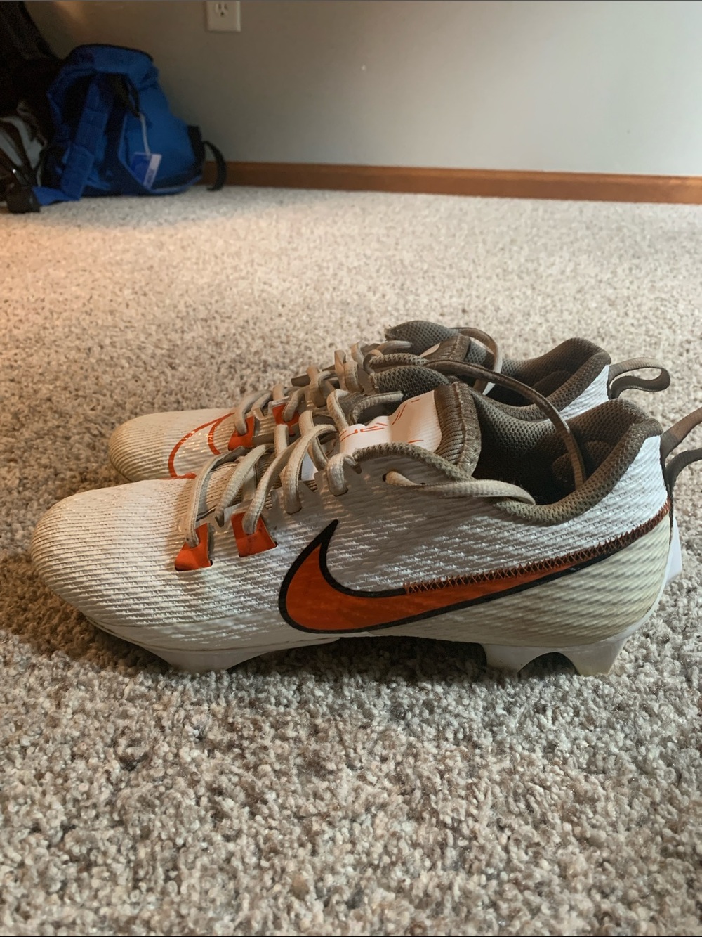 Nike White Cleats with Orange Swoosh and Tan Accents
